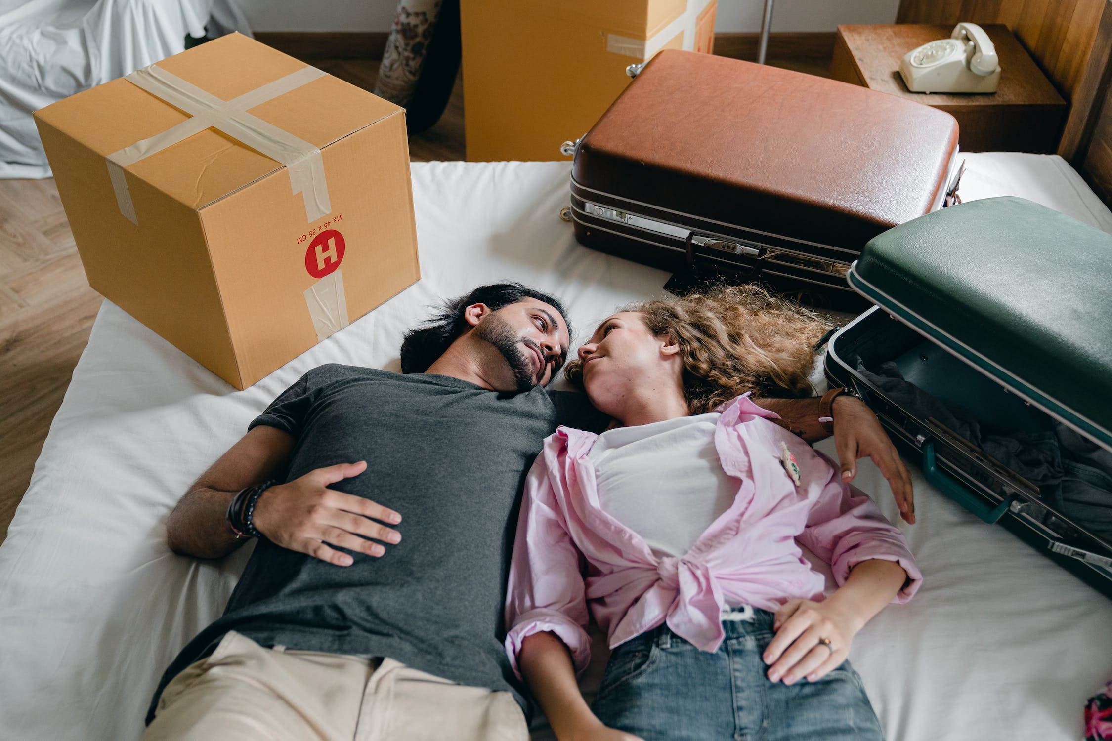 expat mortgage two people on a bed